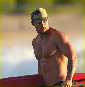 EXCLUSIVE: A shirtless Jason Momoa coming in from a surf session in Hawaii.